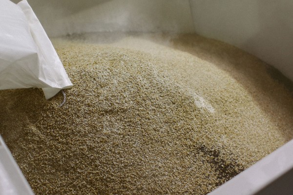 Malts being poured in the Grsit Hopper